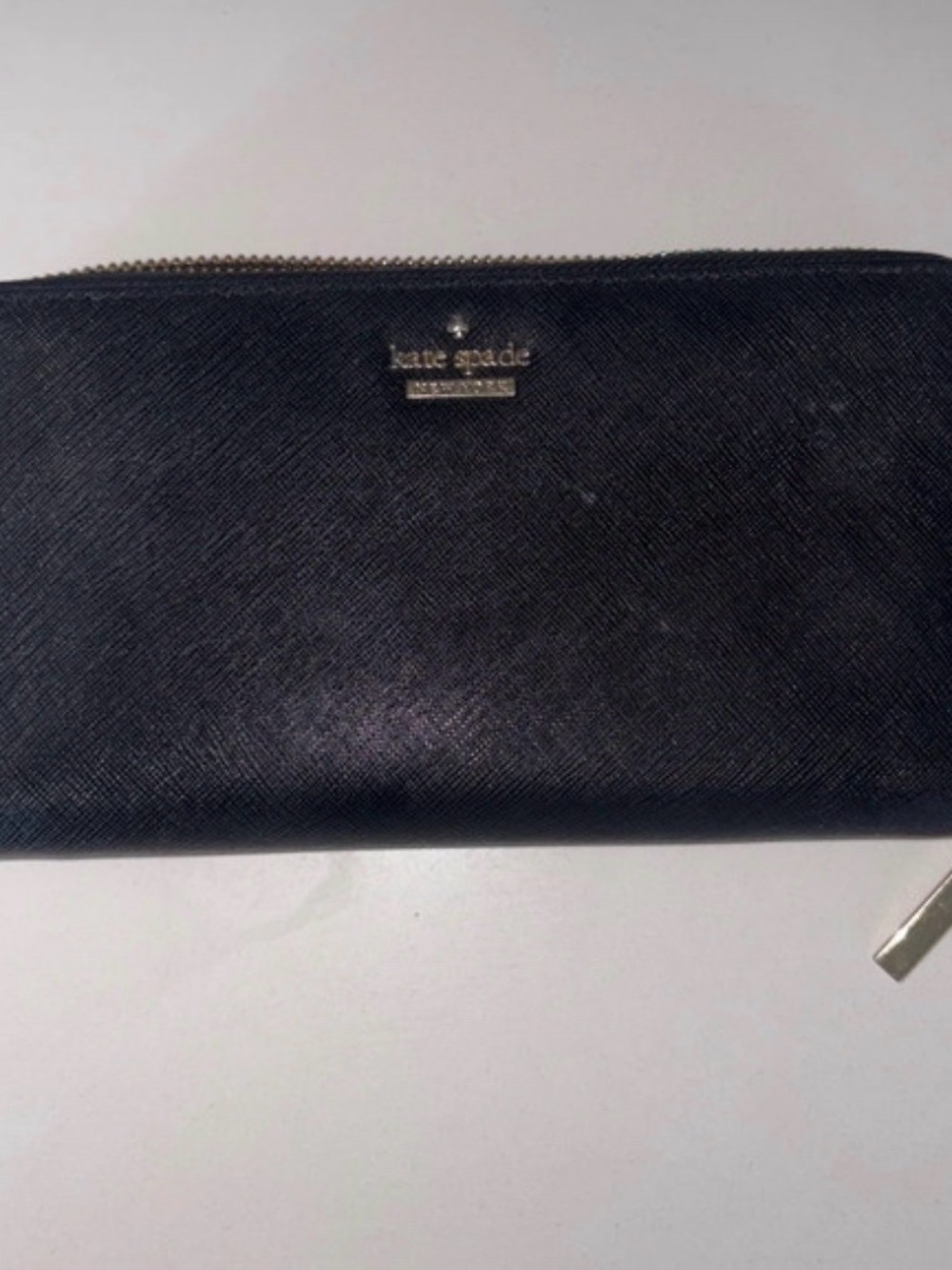 kate spade black saffiano zip-around wallet with gold logo